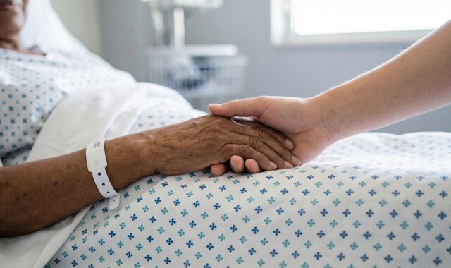 hands, holding hands, hospital, care, support, empathy, patient, medical care, compassion, recovery, bandages, elderly, family, emotional bond, comfort, touch, kindness