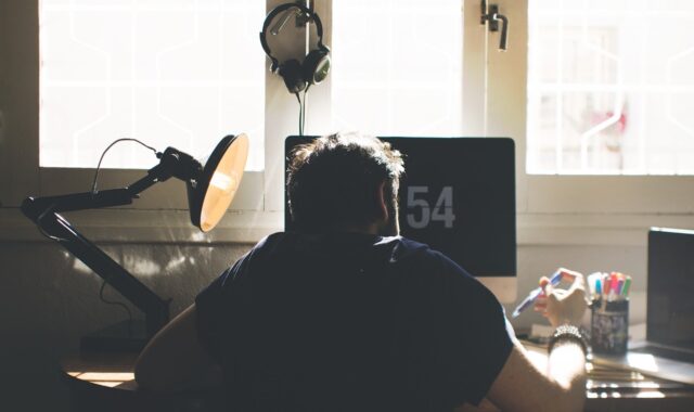 man, chair, computer, desk, sit, seated, electronics, indoors, lamp, laptop, room, workspace, home office, work from home, computer, desk, laptop, room, home office, home office, home office, home office, home office